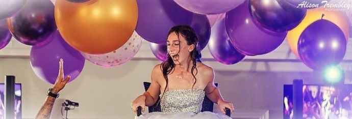 Photograph: Close-up of the bride's hands holding a bouquet of pink and white flowers